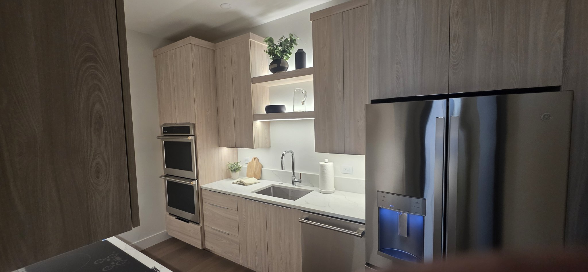 Light wood kitchen cabinet installation with double ovens in Missoula