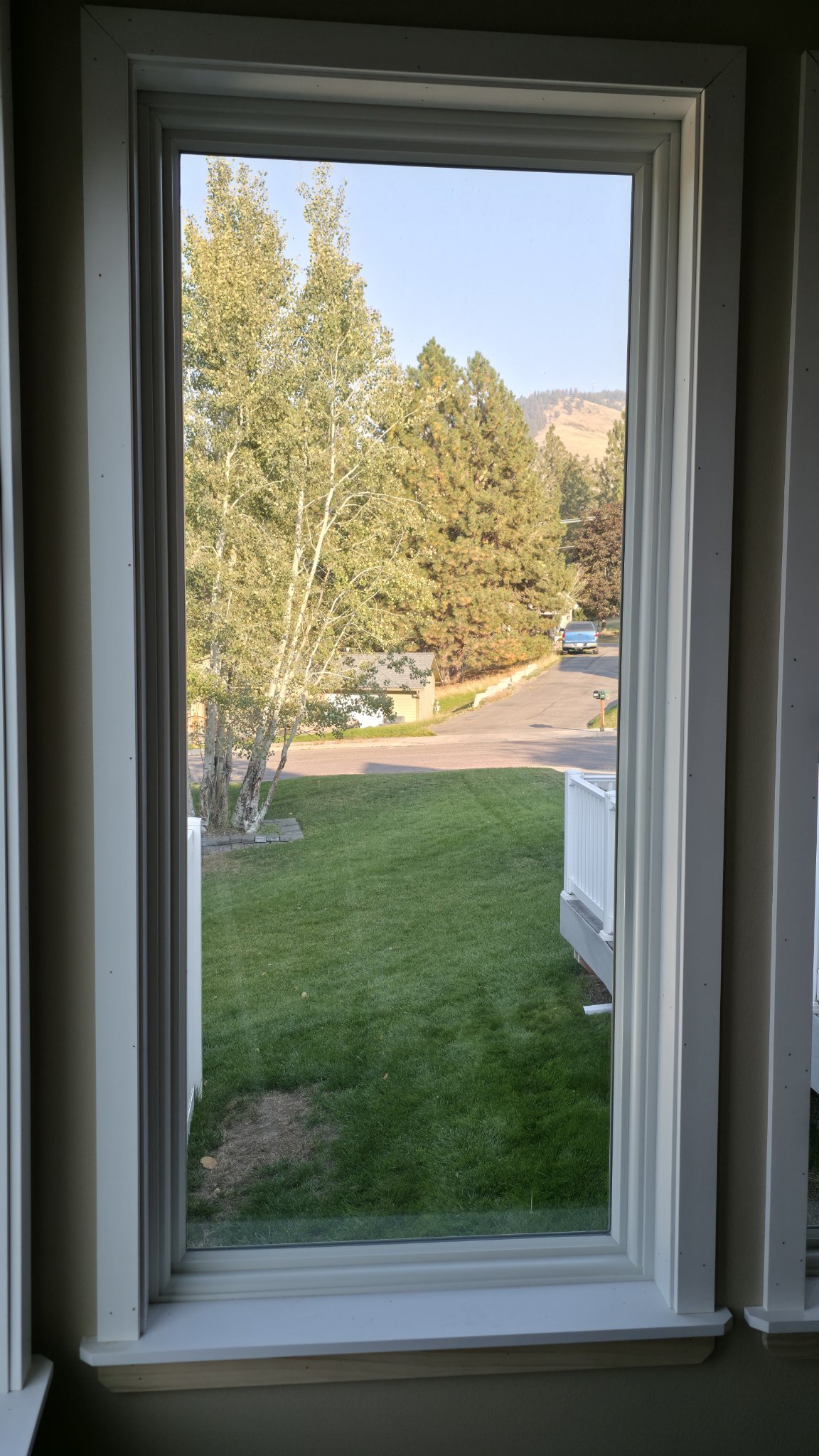 Cased window with finished trim in a Missoula home